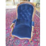 A Victorian mahogany upholstered button back scroll armchair, 103cm tall x 61cm wide, seat height