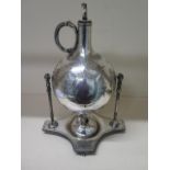 A silver plated Brandy warmer, 36cm tall, some dents to body, engraved cartouche, part of burner