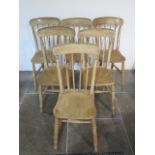 A set of six Victorian stick back ash and elm kitchen chairs, all generally sturdy,