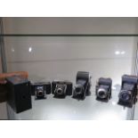 Five vintage folding cameras to include a Zeiss Ikon Nettar 6 x 9cm with 11cm 4.5 lens in case,