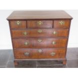 An 18th century walnut chest with three small drawers cross banded feather edge oak lined drawers