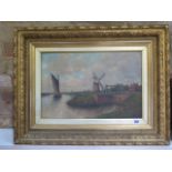 An oil on canvas barge on the river with windmills in the background in a gilt frame, frame size
