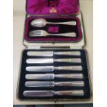 A boxed Mappin and Webb silver christening set, missing its serviette ring but good condition, and a