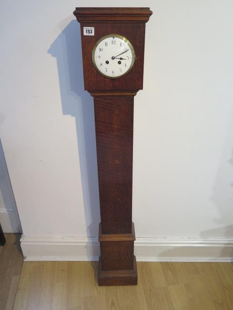 An oak case 8 day granddaughter clock with French striking movement - Height 126cm - cracks to