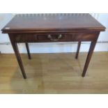 A Georgian mahogany foldover side table with a drawer on square tapering legs with a good rich