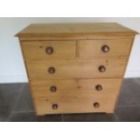 A 19th century pine chest with two short over three long drawers, 96cm wide x 94cm tall, in good