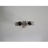 A hallmarked 9ct five stone dress ring, size P, approx 1.9 grams, possibly sapphire but not diamond,