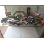 A collection of tinplate Horby 0 gauge rolling stock and buildings and three locos, two running, all