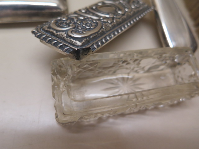 A three piece silver back dressing table set, a silver top tidy, a silver napkin ring, a silver - Image 2 of 3