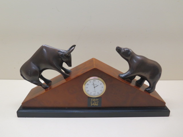 A Bey-Berk quartz mantle clock with bronze bull and bear, some wear to back of case but in working