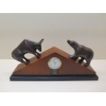 A Bey-Berk quartz mantle clock with bronze bull and bear, some wear to back of case but in working