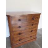 A 19th century flame mahogany chest with two short over three long drawers with rounded corners,