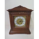 An oak striking mantle clock with a Lenzkirch movement with pendulum and key, in working order, 38cm