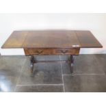 A mahogany dropleaf coffee table with two small drawers, 51cm tall x 129cm extended by 41cm