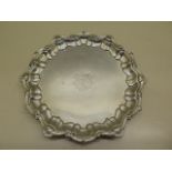 A silver salver, London 1898/99 maker H.S 22cm wide, engraved with initials, minor dents but