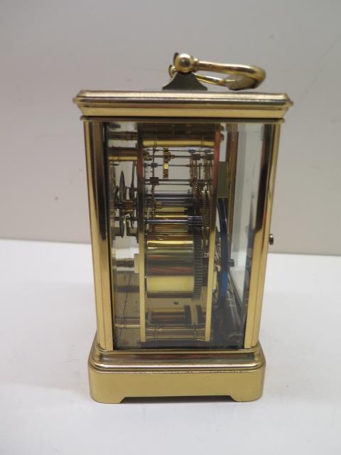 A brass French carriage clock strikes hours and half hours, 8 day movement, 15cm tall, in running - Image 2 of 3