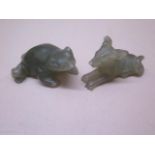 A green soapstone carved frog and a soapstone carved dog, 5.5cm and 6cm long, small chips to both