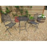 A Kettler folding metal bistro set, table 72cm tall x 60cm diameter