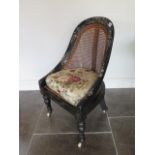 A Victorian ebonised mother of pearl inlaid caned bergere childs side chair, 77cm tall x 40cm