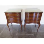 A pair of burr walnut serpentine bedside three drawer chests on cabriole legs both with glass