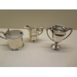 A Victorian silver mustard with a replacement glass liner, a Chester silver jug, and a silver cup