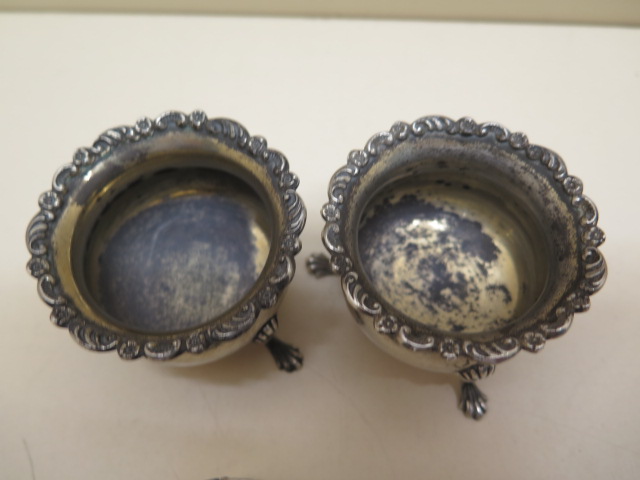 A pair of silver salts, four silver napkin rings and an Eastern white metal embossed mirror, - Image 2 of 6