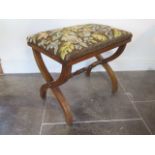 A mahogany cross frame stool with a needlepoint seat, 45cm tall x 52cm x 36cm