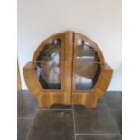 A walnut Art Deco globe two door display cabinet, 124cm tall x 134cm wide x 34cm deep with one glass