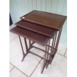 A nest of three mahogany side tables 68cm tall x 51cm x 34cm, repair to two legs otherwise generally
