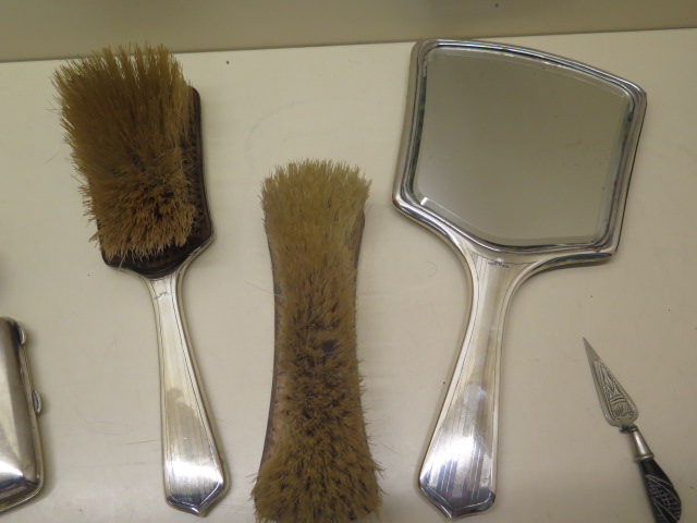 A three piece silver back dressing table set, a silver top tidy, a silver napkin ring, a silver - Image 3 of 3