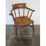 A 19th century ash and elm smokers bow armchair with a well shaped seat, 81cm tall x 67cm wide, seat