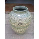 A decorative terracotta planter, 56cm tall