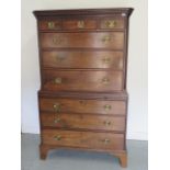 A Georgian Mahogany chest on chest with three small drawers above six long drawers and a brushing sl