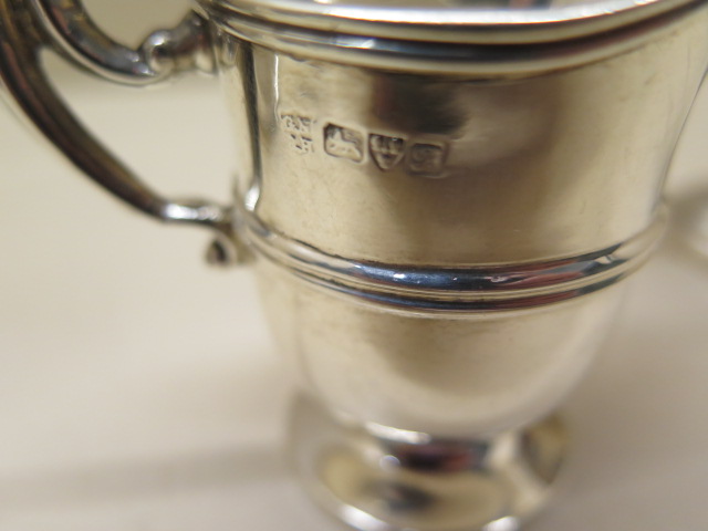 A Victorian silver mustard with a replacement glass liner, a Chester silver jug, and a silver cup - Image 4 of 5