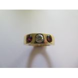 A garnet and diamond 9ct ring, the central diamond approx 0.45ct, size N, approx 12 grams, marked