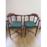 A pair of Edwardian inlaid mahogany corner chairs both in generally good condition with