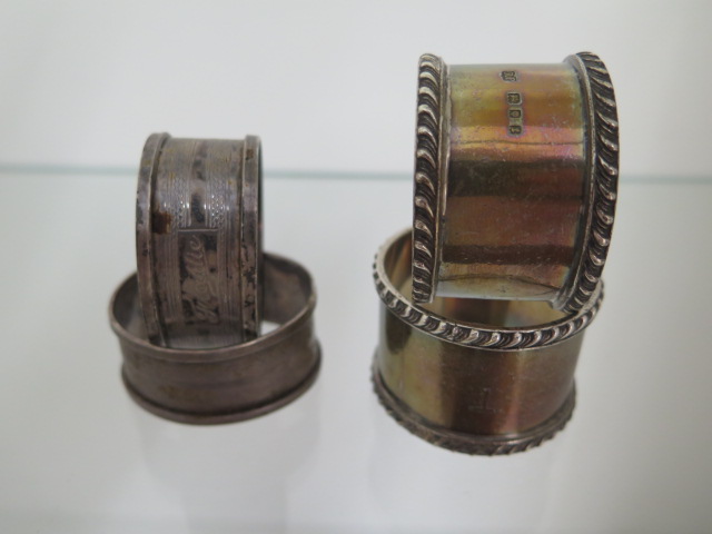 Two pairs of silver napkin rings both with engraving but generally good, approx 4.1 troy oz