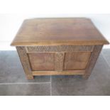 A small carved oak coffer, 41cm tall x 61cm x 37cm, with a good colour