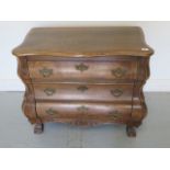 A well figured oak bombe shaped three drawer chest in restored condition, 66cm tall x 76cm x 41cm,