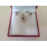 A 14ct yellow gold sapphire and diamond pendant and earring set marked 14K and 585 to pendant,