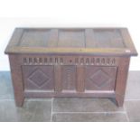 An 18th century carved three panel oak coffer, 55cm tall x 96cm x 45cm, general age related wear but