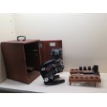 A Carl Zeiss Jena 15x binocular microscope with assorted lens and a mahogany case