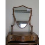 A mahogany shield shaped dressing table mirror with three small drawers, 55cm tall x 46cm wide