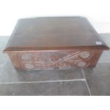 An 18th century carved oak bible box, 23cm tall x 63cm x 43cm