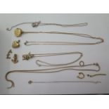Three 9ct gold pendants, one on a 86cm chain, two on a 54cm chain, two loose pendants, a locket,