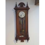 A 19th century double weight wall clock by Gustav Becker with two piece dial, 115cm tall, in running