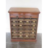 A Victorian tambour fronted filing cabinet with 24 pigeon holes each with alphabetic labels, 77cm