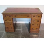 A Victorian mahogany nine drawer twin pedestal desk with leather insert top, 74cm tall x 119cm 60cm,