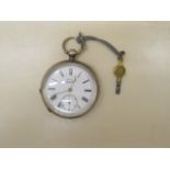 A silver key wind pocket watch Kays Triumph, 5cm wide, running order, crack to dial but generally