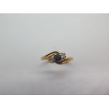 A pretty 18ct yellow gold diamond and sapphire crossover ring, marked 18, ring size R, approx 3